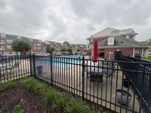 a view of a large with iron fence