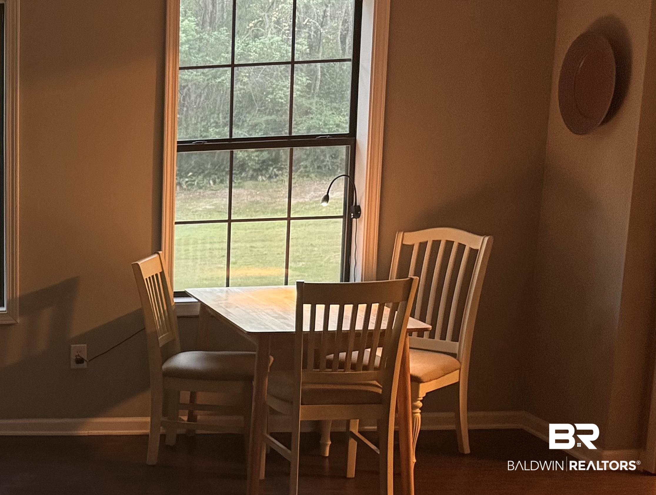 1302 Oak Street Daphne, AL 36526 - Photo 12 of 34 Dining area with baseboards and dark wood-style flooring