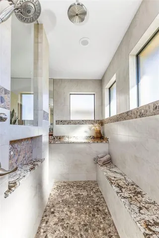 a kitchen with kitchen island a stove and refrigerator
