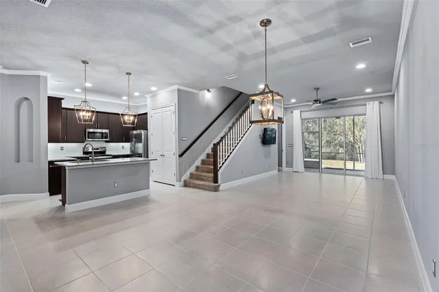 a view of a kitchen with furniture and a window