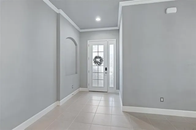 a view of a hallway with wooden shelves