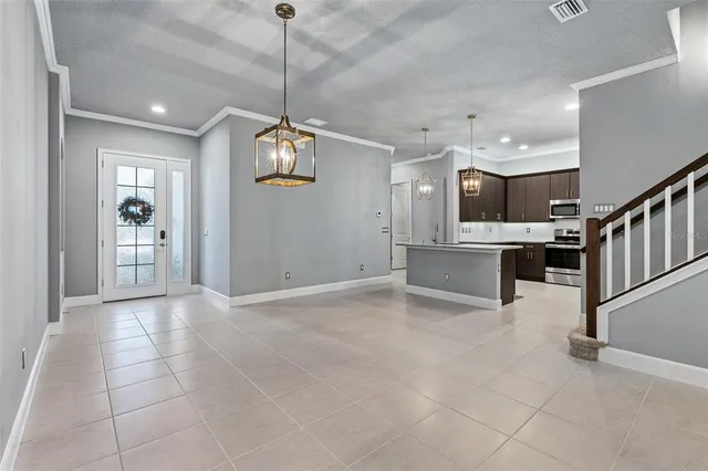a view of a kitchen with a sink and dishwasher cabinet with wooden floor