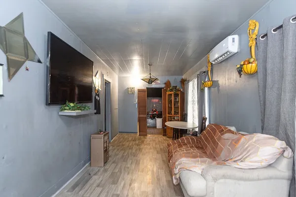 a bed room with a bed and a television