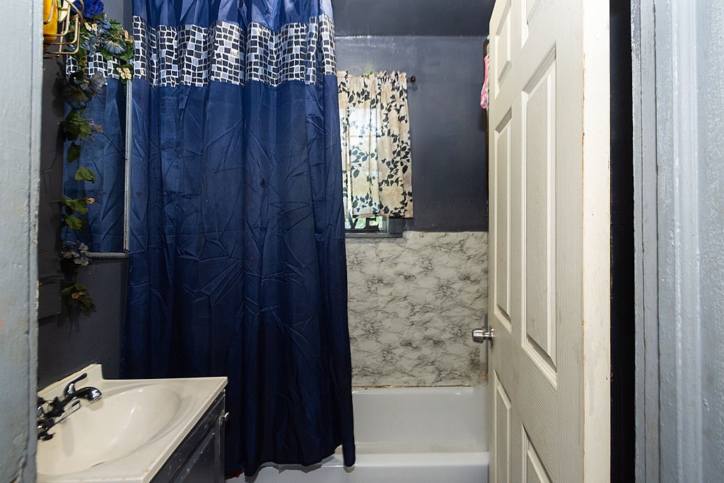 2531 Jones Street Houston, TX 77026 - Photo 15 of 15 a bathroom with a sink and a tub
