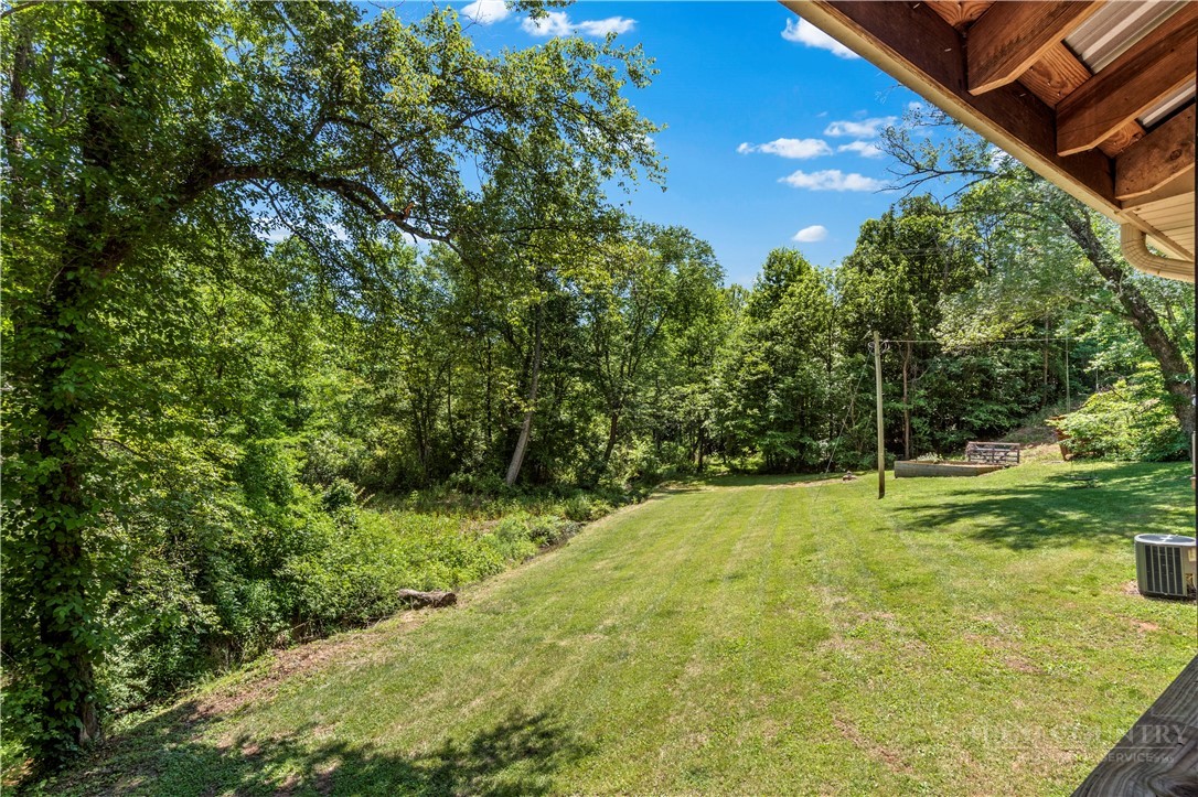 142 Pioneer Road Harmony, NC 28634 - Photo 43 of 49 a view of a yard with a house
