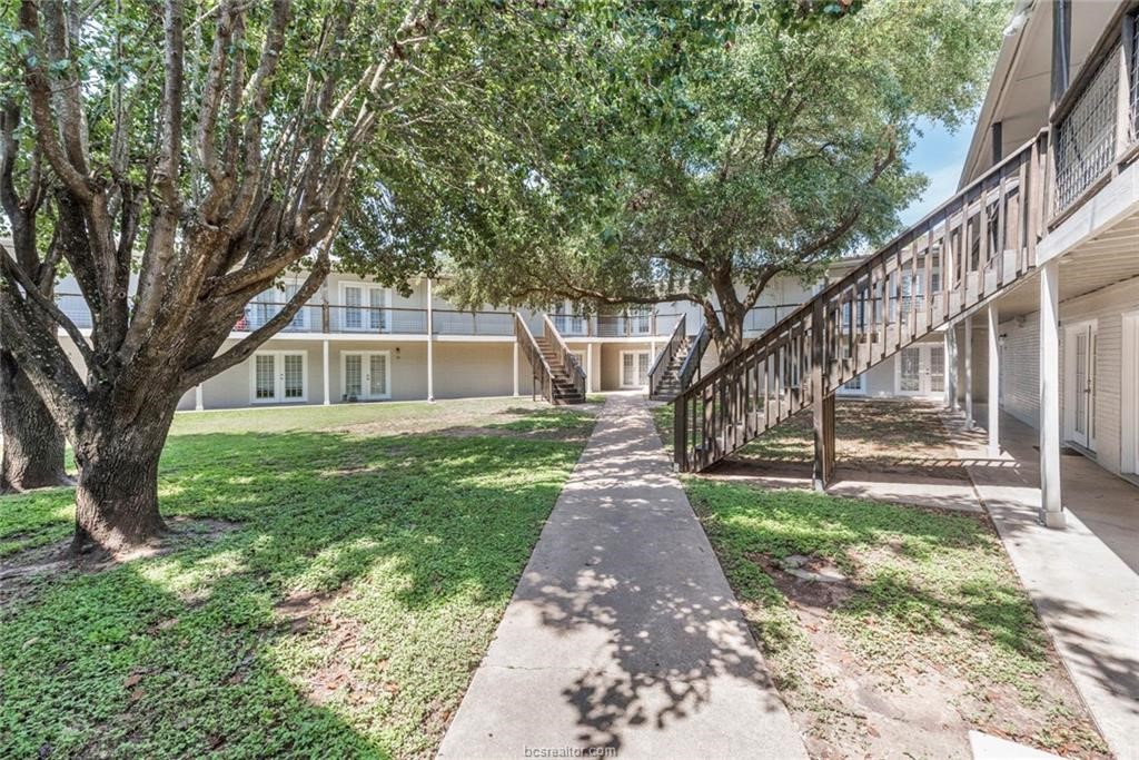 3900 Old College Road, Unit 2 Bryan, TX 77801 - Photo 3 of 10 a front view of a house with a yard