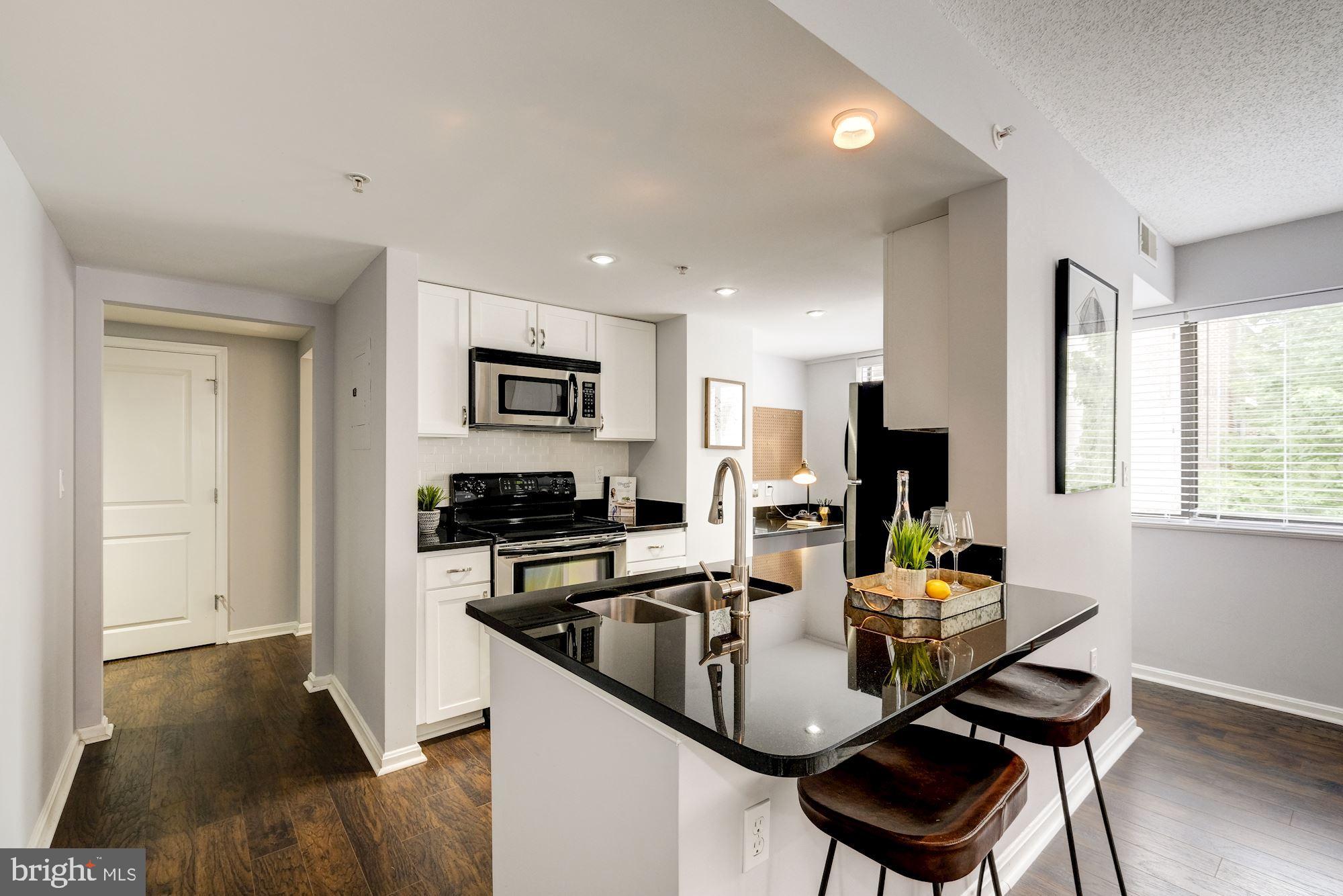 1225 13th Street Northwest, Unit 307 Washington, DC 20005 - Photo 3 of 17 Kitchen with Breakfast Bar