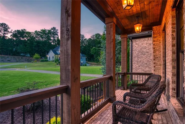 a living room with furniture a window and wooden floor