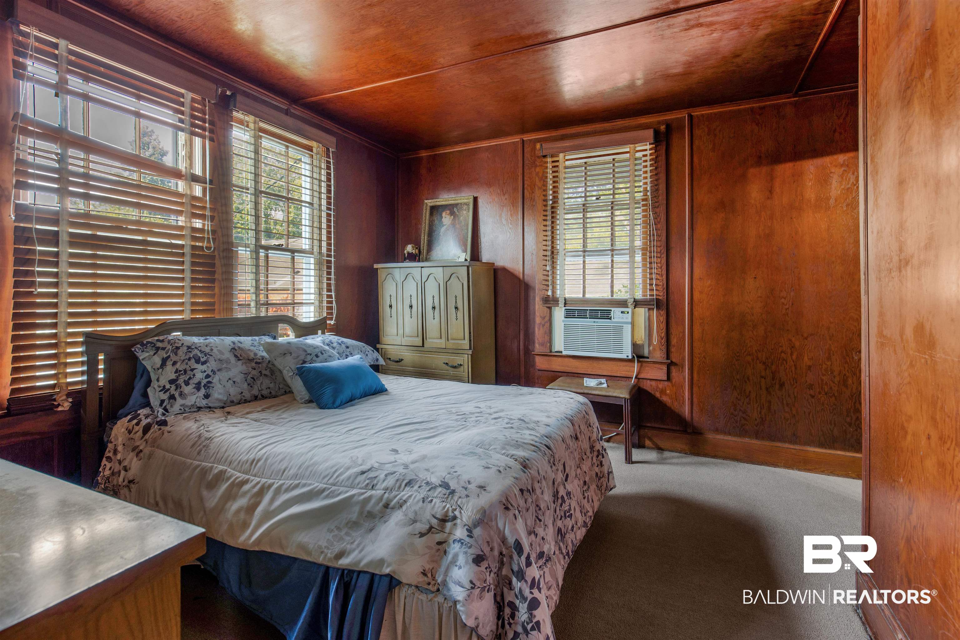 4306 Stein Street Mobile, AL 36608 - Photo 21 of 30 Carpeted bedroom with wooden walls, cooling unit, and wood ceiling