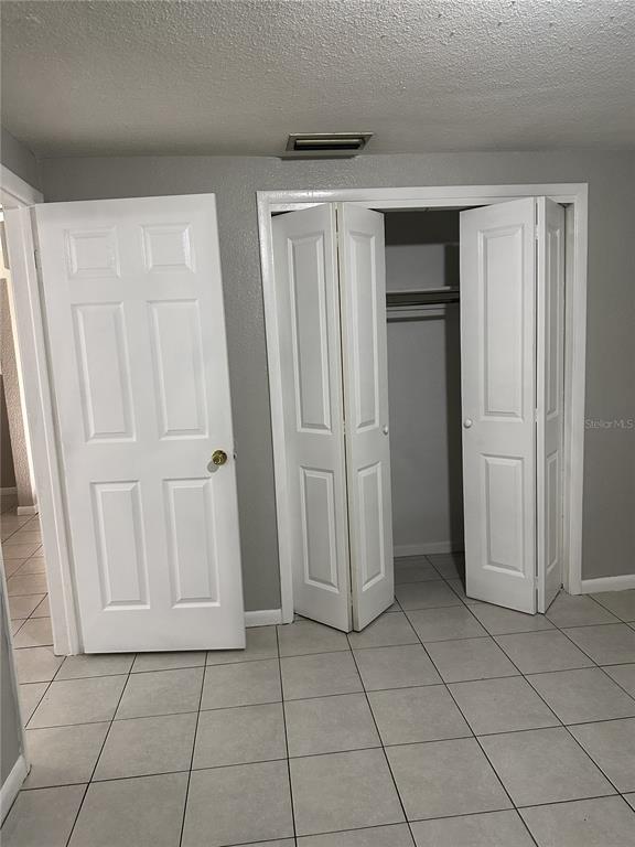 5509 Riddle Road Holiday, FL 34690 - Photo 11 of 13 a view of a utility room with closet area