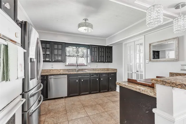 a kitchen with a sink stove and refrigerator