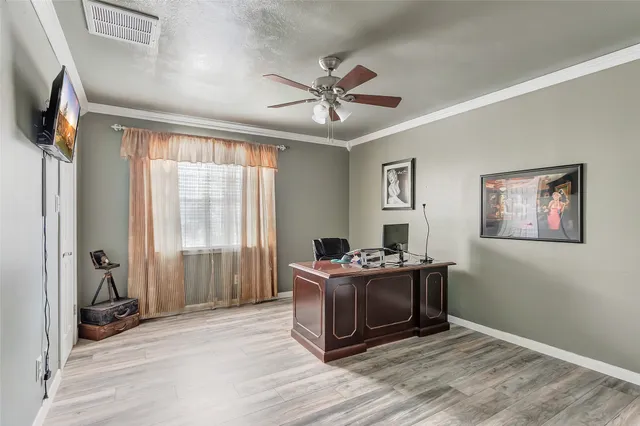 a living room with a bed furniture and a window
