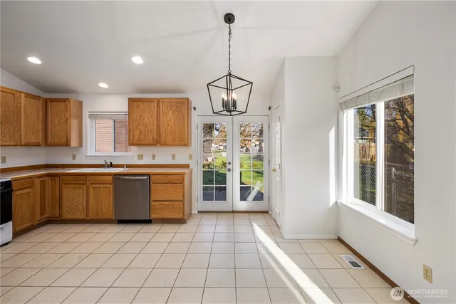 a kitchen with a stove a sink and a refrigerator