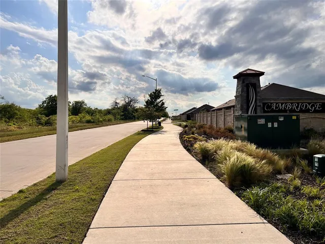 a view of a hallway with seating area