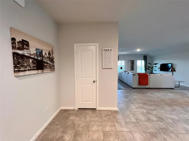 a kitchen with kitchen island granite countertop a sink counter top space and living room