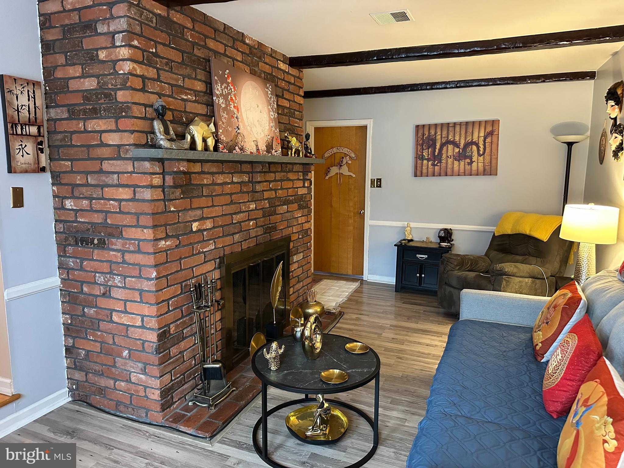 320 West Orvilla Road Hatfield, PA 19440 - Photo 15 of 46 a living room with furniture and a fireplace