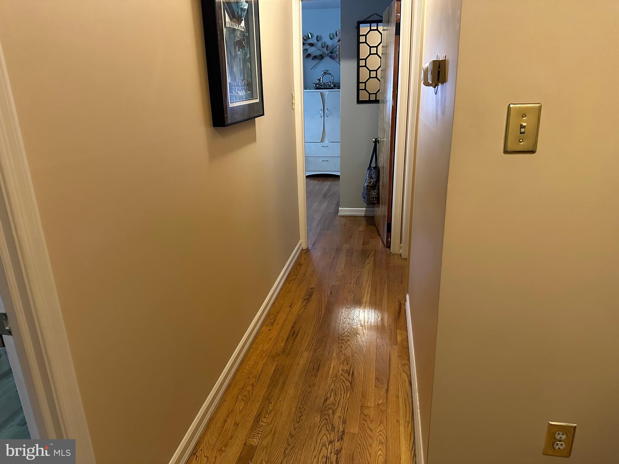 320 West Orvilla Road Hatfield, PA 19440 - Photo 24 of 46 a view of a hallway with wooden floor and a bathroom