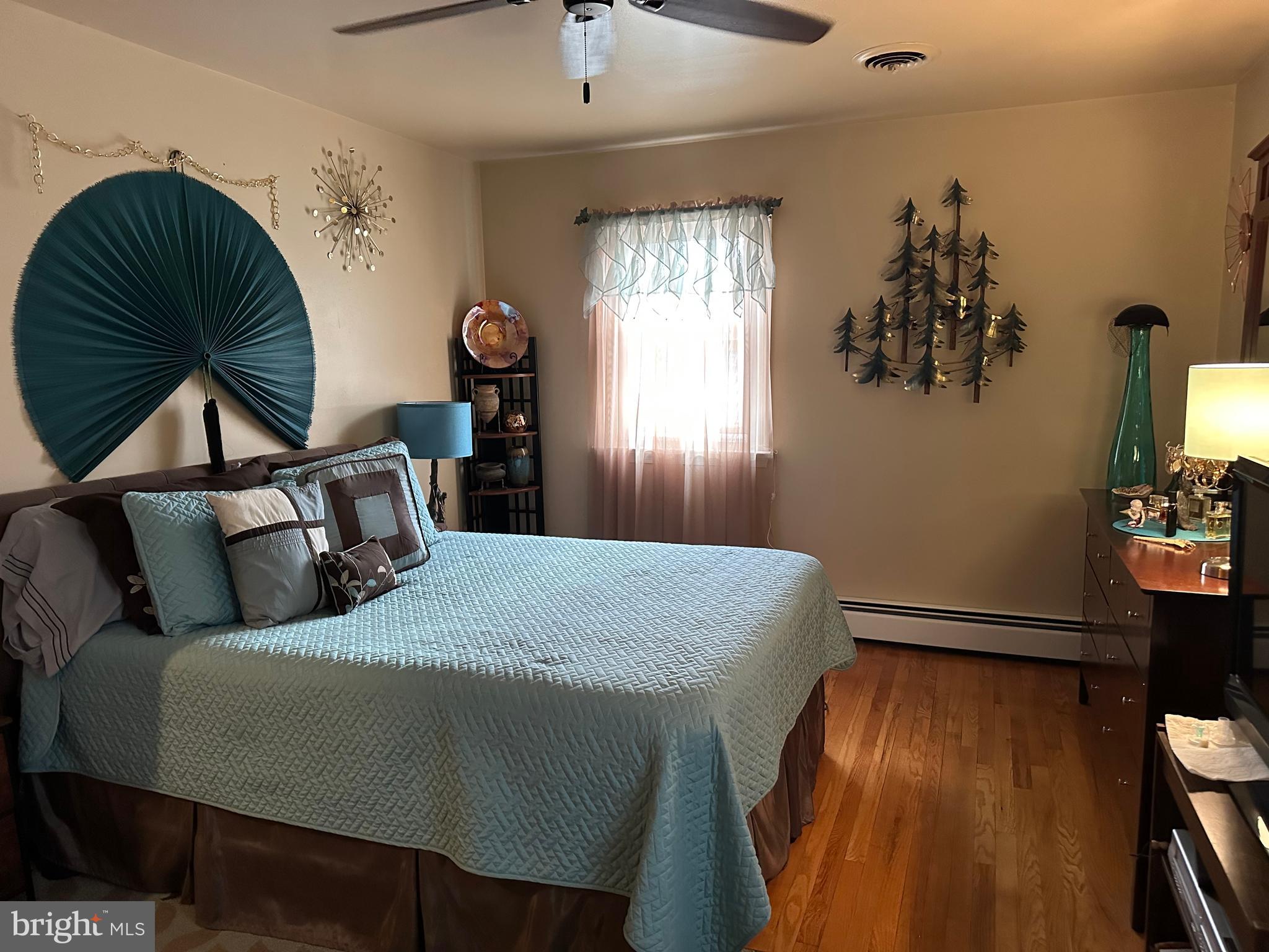 320 West Orvilla Road Hatfield, PA 19440 - Photo 26 of 46 a bed sitting in a bedroom next to a window
