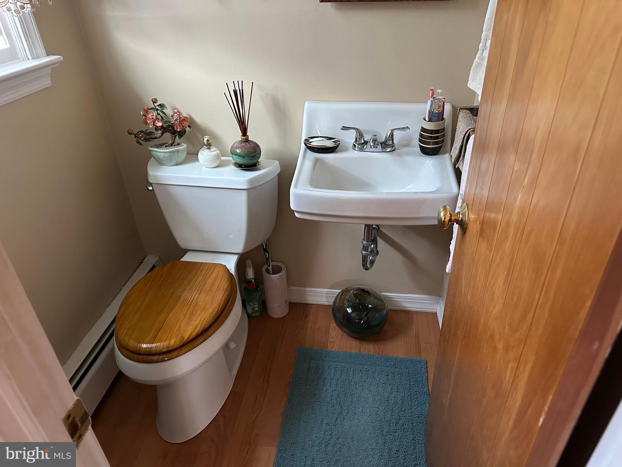 320 West Orvilla Road Hatfield, PA 19440 - Photo 28 of 46 a bathroom with a sink mirror and toilet