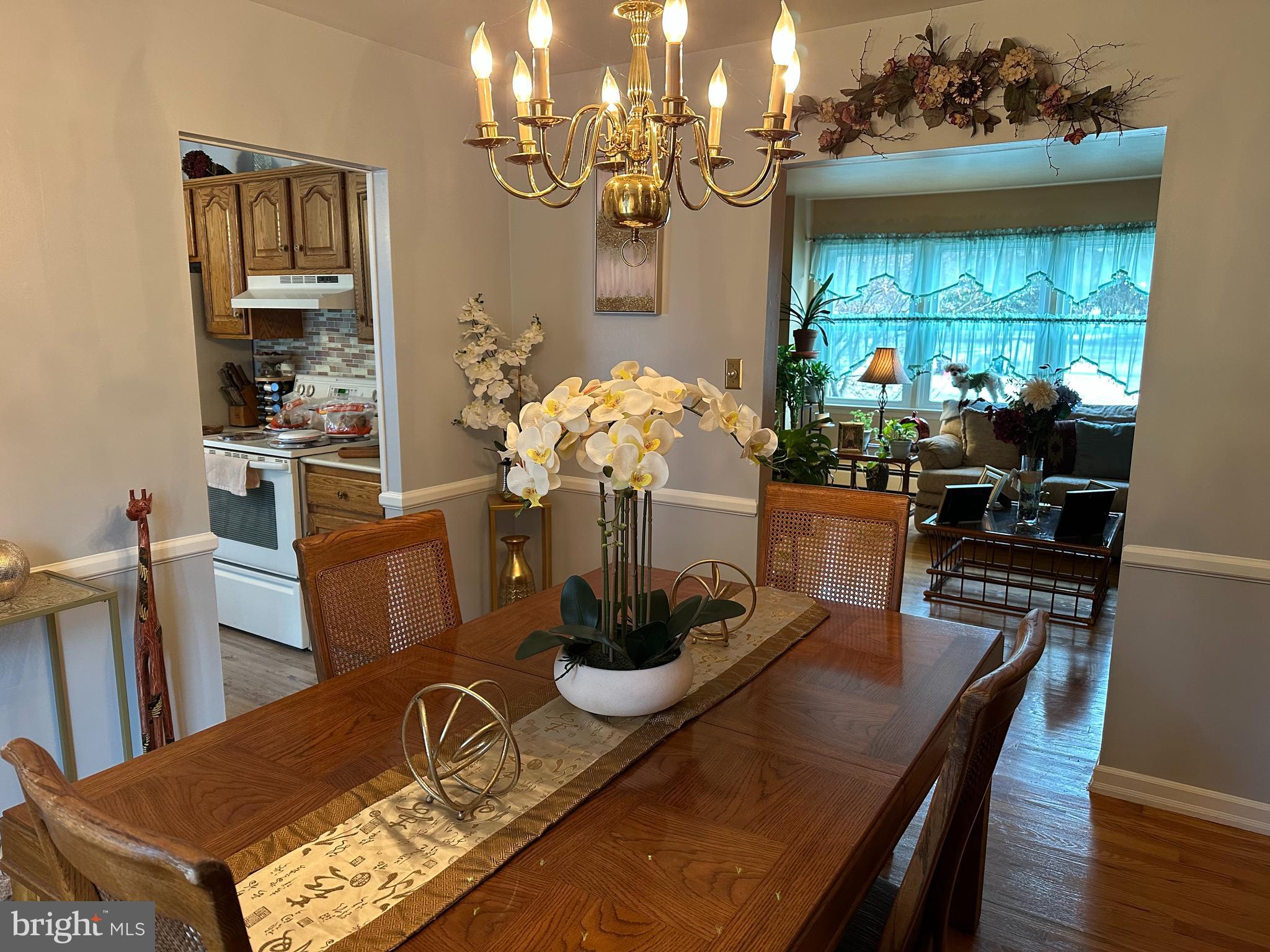 320 West Orvilla Road Hatfield, PA 19440 - Photo 9 of 46 a dining room with furniture a chandelier and wooden floor