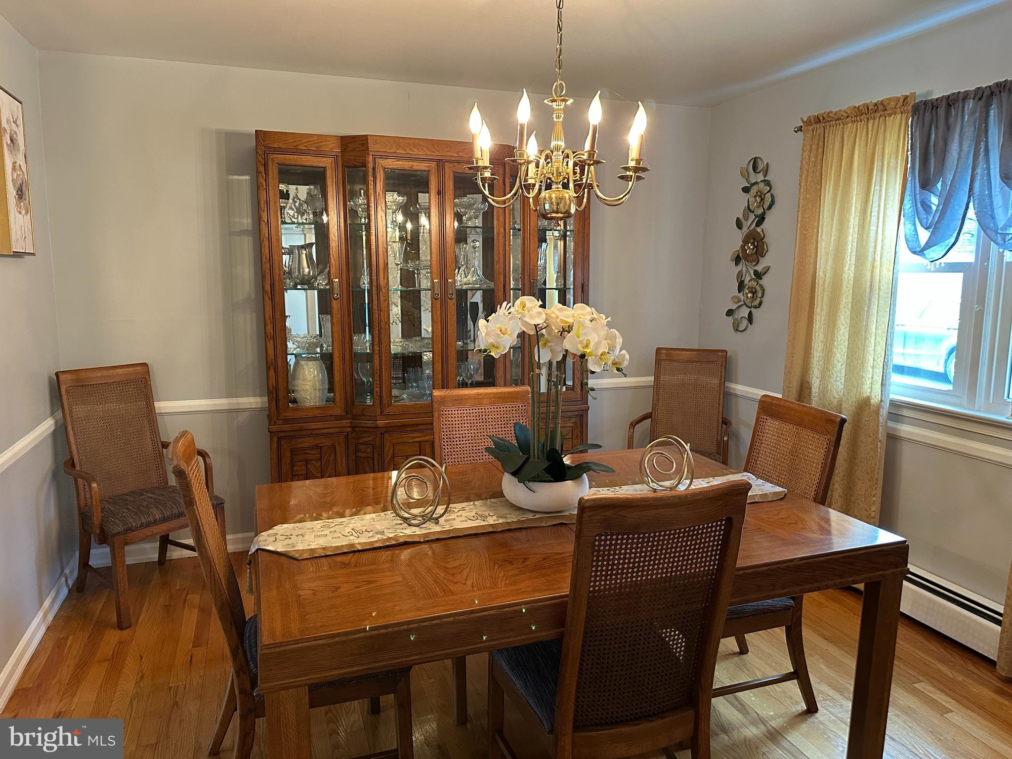 320 West Orvilla Road Hatfield, PA 19440 - Photo 10 of 46 a dining room with furniture a chandelier and wooden floor