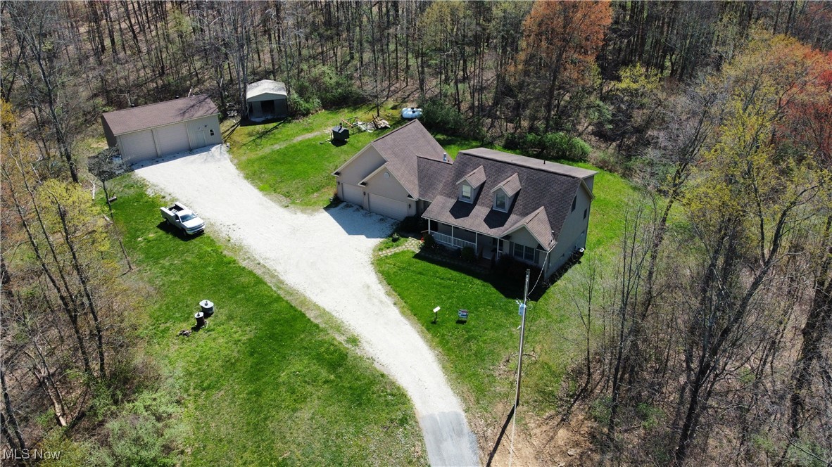6020 Factor Road Southwest Sherrodsville, OH 44675 - Photo 36 of 39 Drone / aerial view featuring a wooded view