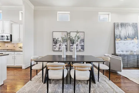 a kitchen with a table and chairs