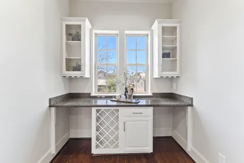 a bathroom with a toilet sink vanity and mirror