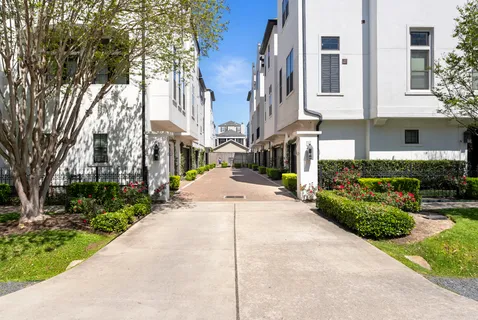 a view of a street with houses on both side