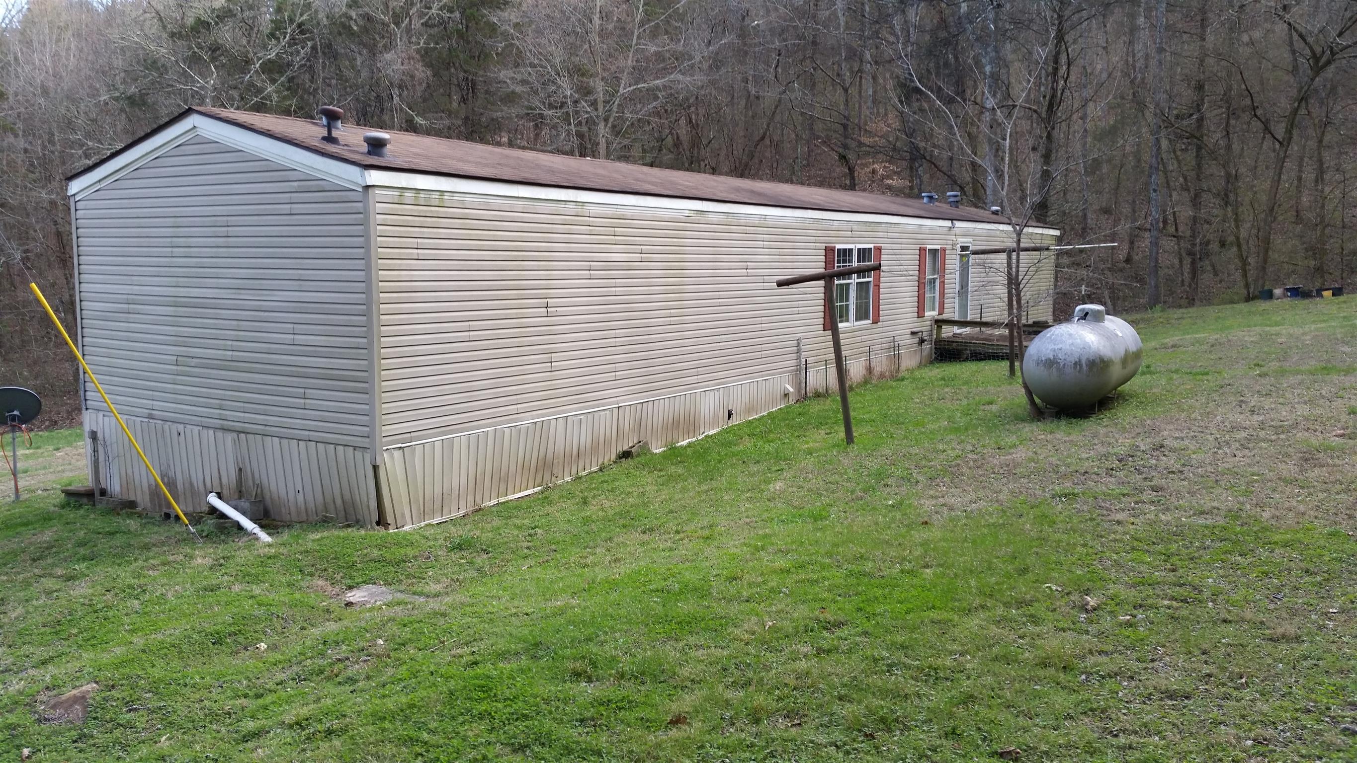 277 Hiwassee Road Lebanon, TN 37087 - Photo 2 of 15 a view of a backyard with barn and wooden fence