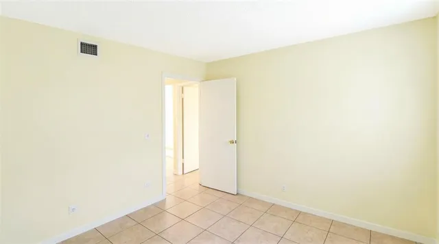 a view of a room with white walls