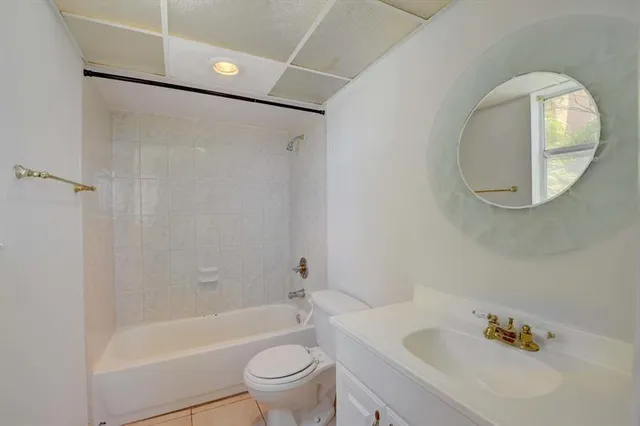 a bathroom with a bathtub toilet and sink