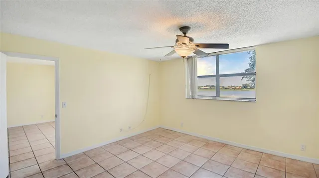 a view of a chandelier fan and entryway