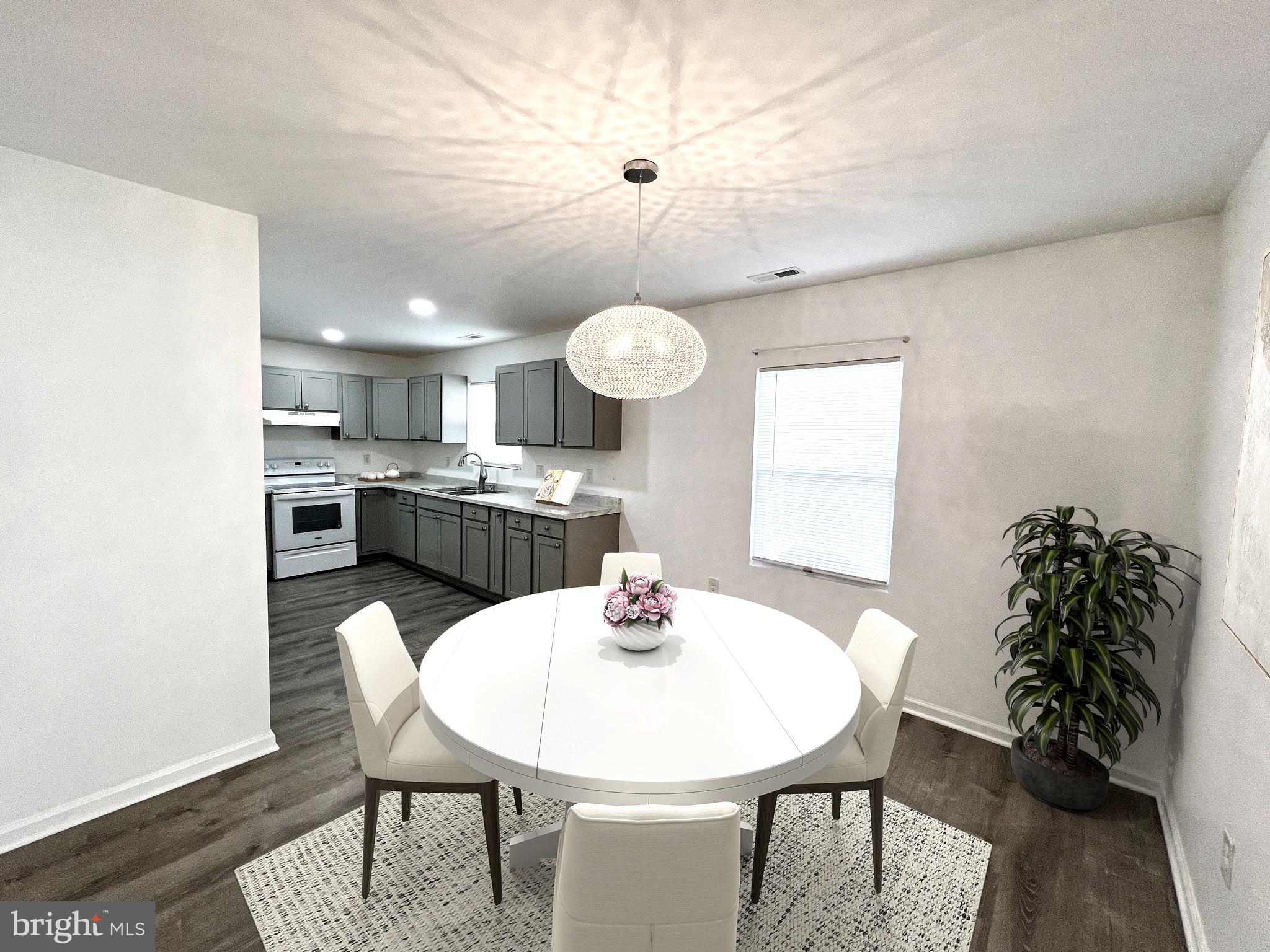315 Shepherd Avenue Cambridge, MD 21613 - Photo 6 of 21 a kitchen with a table and chairs in it