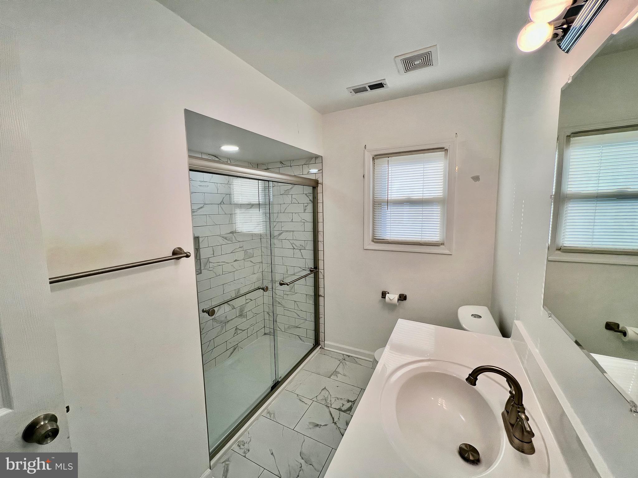 315 Shepherd Avenue Cambridge, MD 21613 - Photo 10 of 21 a bathroom with a bathtub and shower