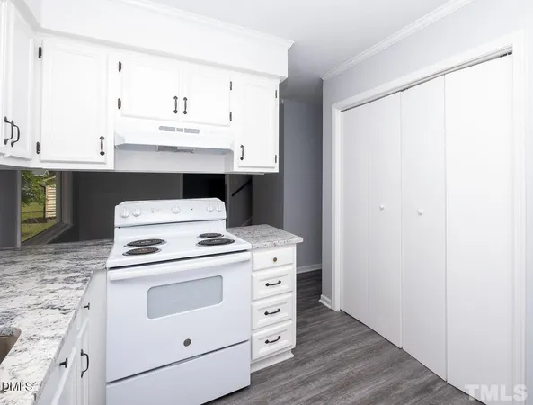a view of cabinets and wooden floor