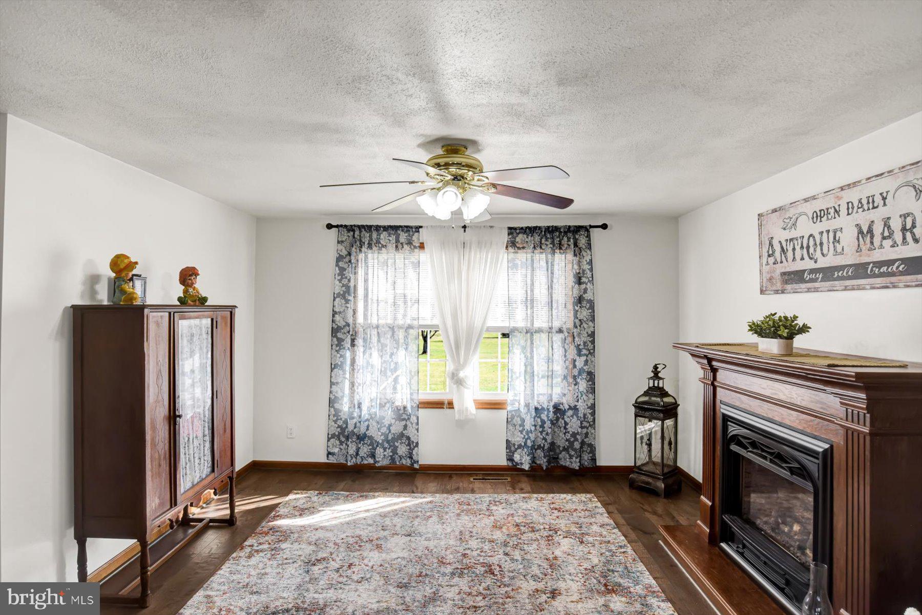 6 James Street Mill Hall, PA 17751 - Photo 11 of 39 a view of a livingroom with a fireplace window and wooden floor