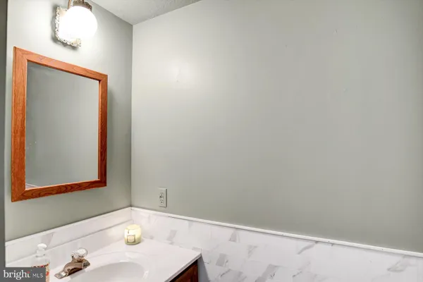 a view of an entryway with wooden floor and windows