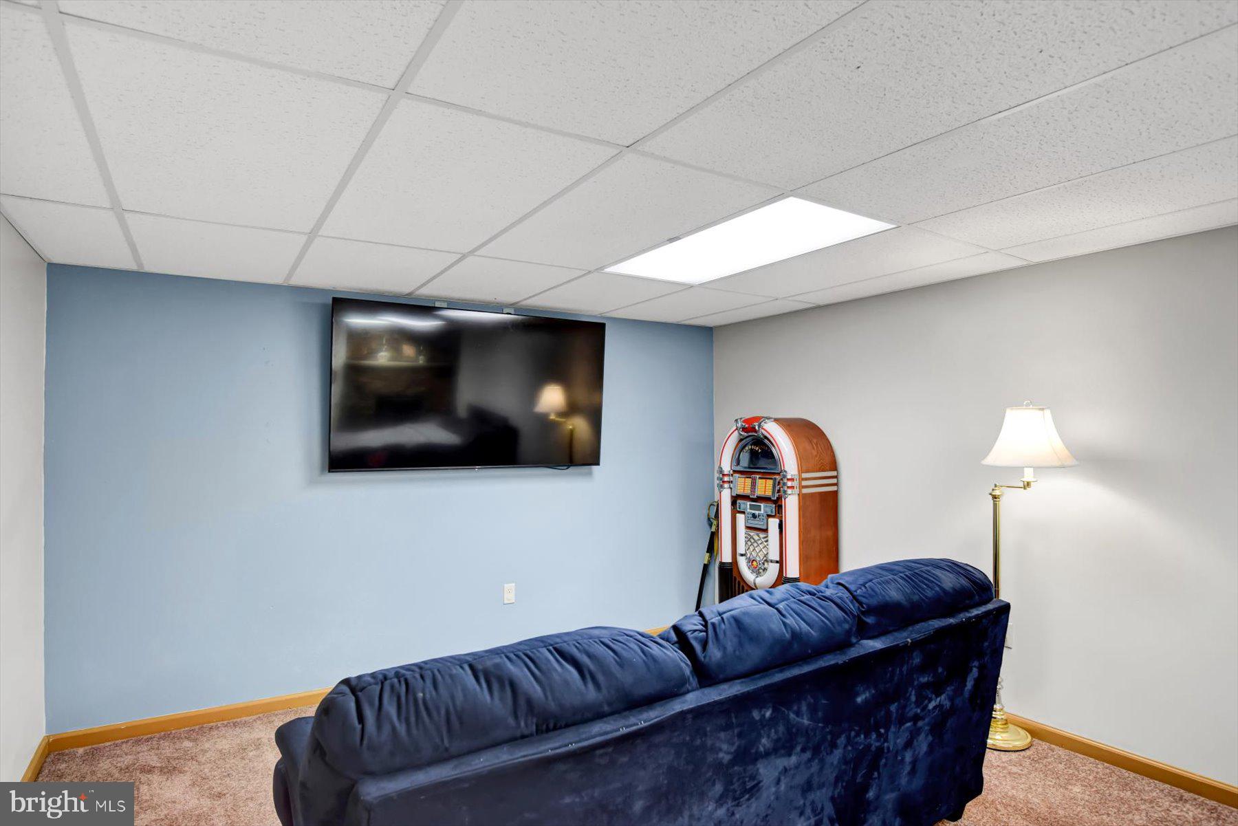 6 James Street Mill Hall, PA 17751 - Photo 27 of 39 a living room with furniture and a flat screen tv