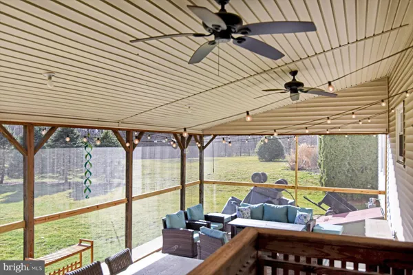 a view of yard with swimming pool and trees