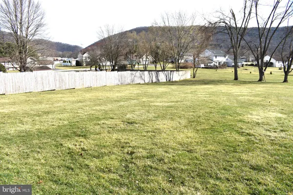 a view of house with yard
