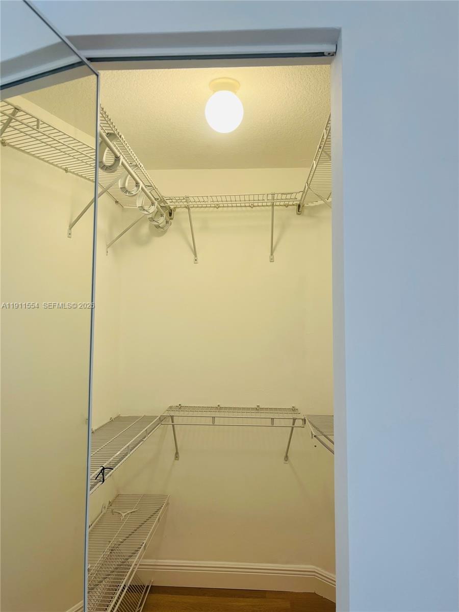 3590 Coral Way, Unit 908 Miami, FL 33145 - Photo 11 of 15 a bathroom with a glass shower door