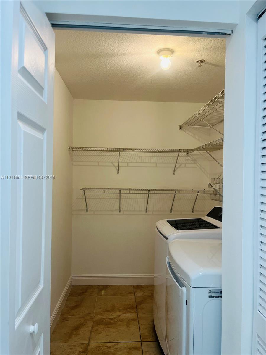 3590 Coral Way, Unit 908 Miami, FL 33145 - Photo 8 of 15 a room with storage and utility