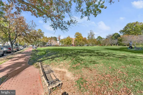 a view of a field with trees around