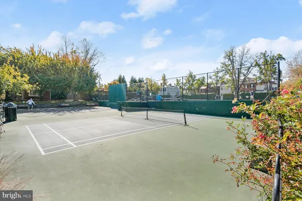 a view of a playground with basketball court