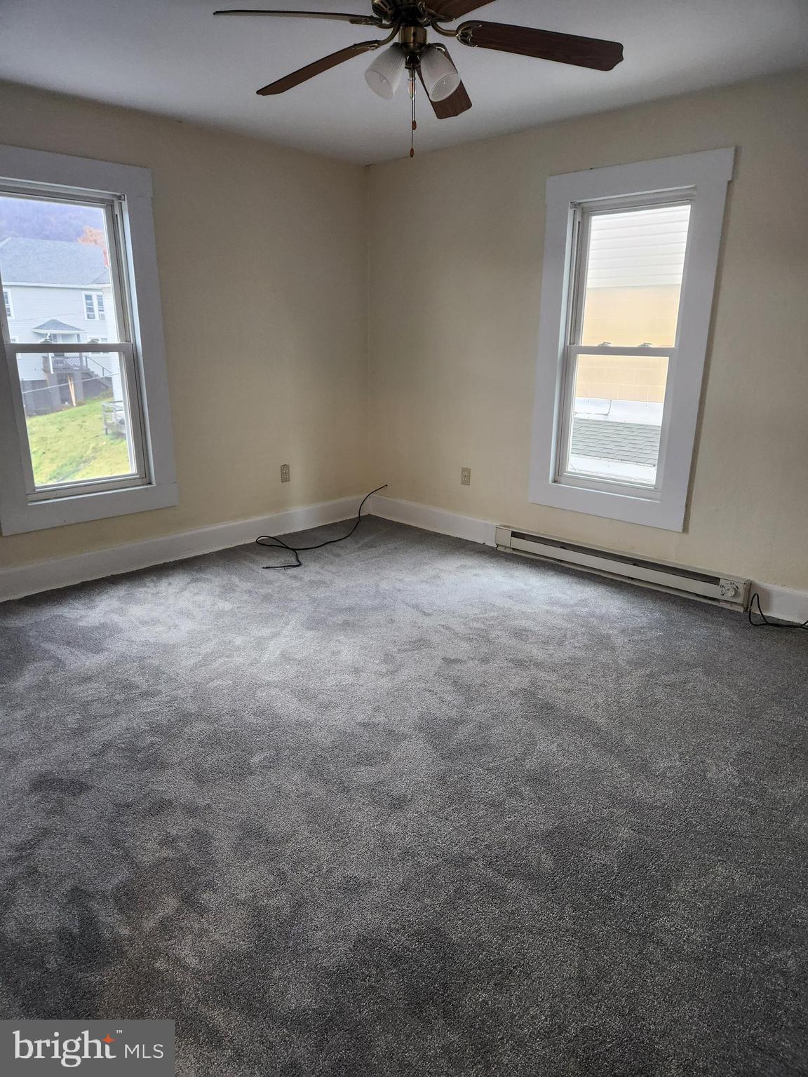 122 Spring Street, Unit B Keyser, WV 26726 - Photo 2 of 8 an empty room with a window