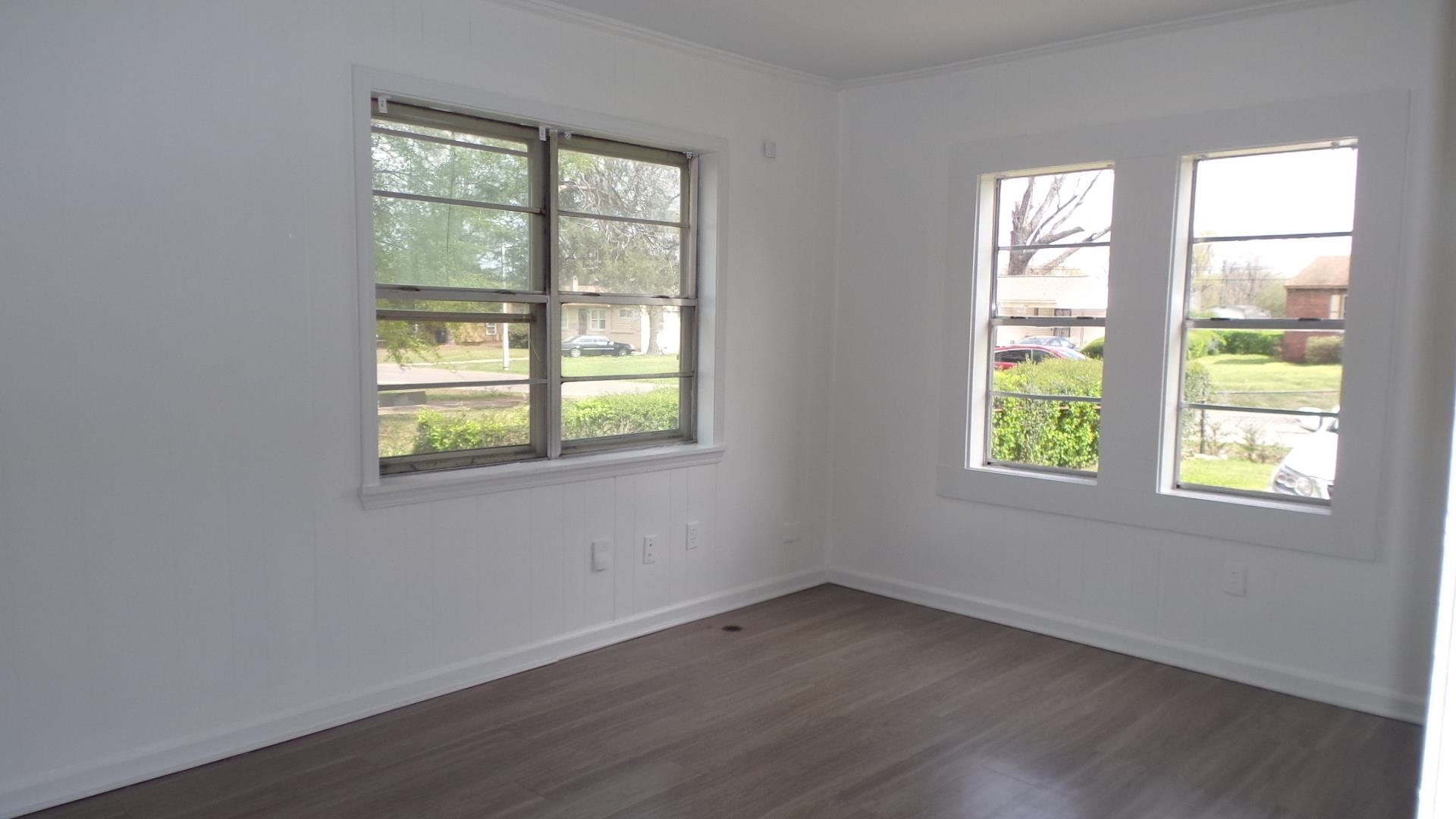 5057 Gill Road Memphis, TN 38109 - Photo 7 of 11 an empty room with a window