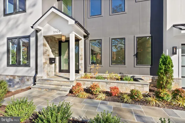 a view of an entryway with wooden floor and a floor to ceiling window