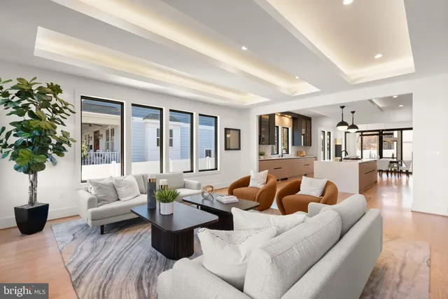 a spacious bedroom with a bed and a chandelier