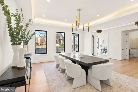 a spacious bathroom with a tub sink and mirror